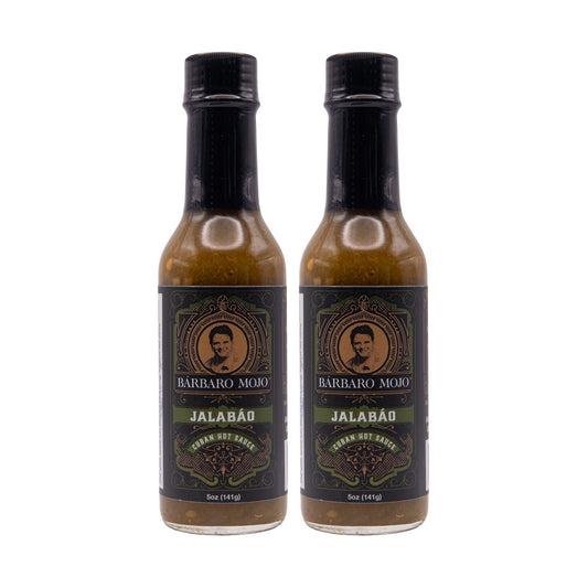 Two bottles of Barbaro Mojo Jalabáo Cuban hot sauce on a white background
