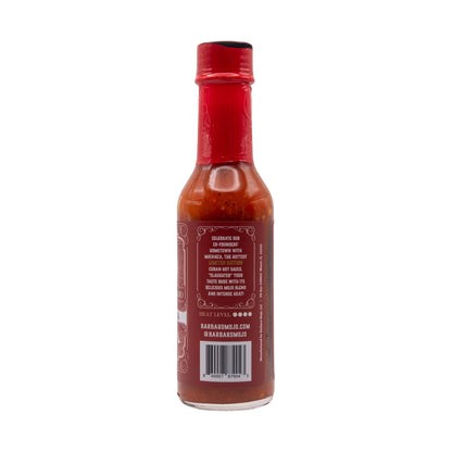 Back label of Barbaro Mojo Matanza Cuban hot sauce with the heat level and barcode