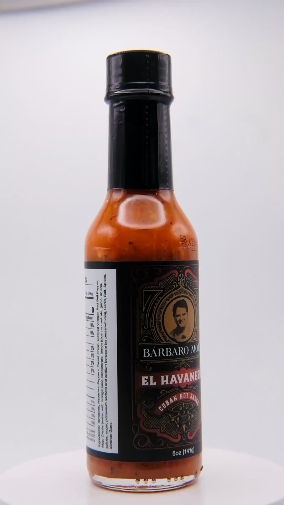 360 degree spin of a bottle of Barbaro Mojo El Havanero Cuban hot sauce with the new foil label