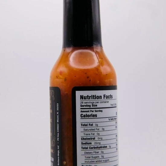 360 degree spin of a bottle of Barbaro Mojo Piñazo Cuban hot sauce with the new foil label