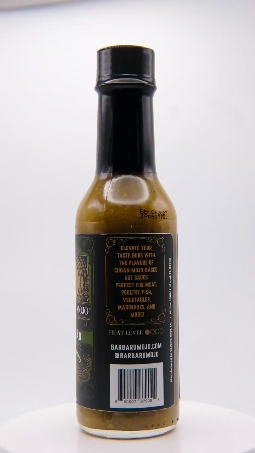 360 degree spin of a bottle of Barbaro Mojo Jalabáo Cuban hot sauce with the new foil label