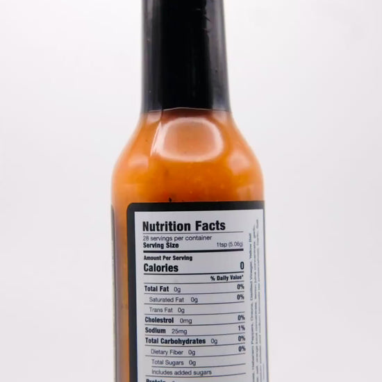 360 degree spin of a bottle of Barbaro Mojo Best Day Ever Cuban hot sauce with the new foil label