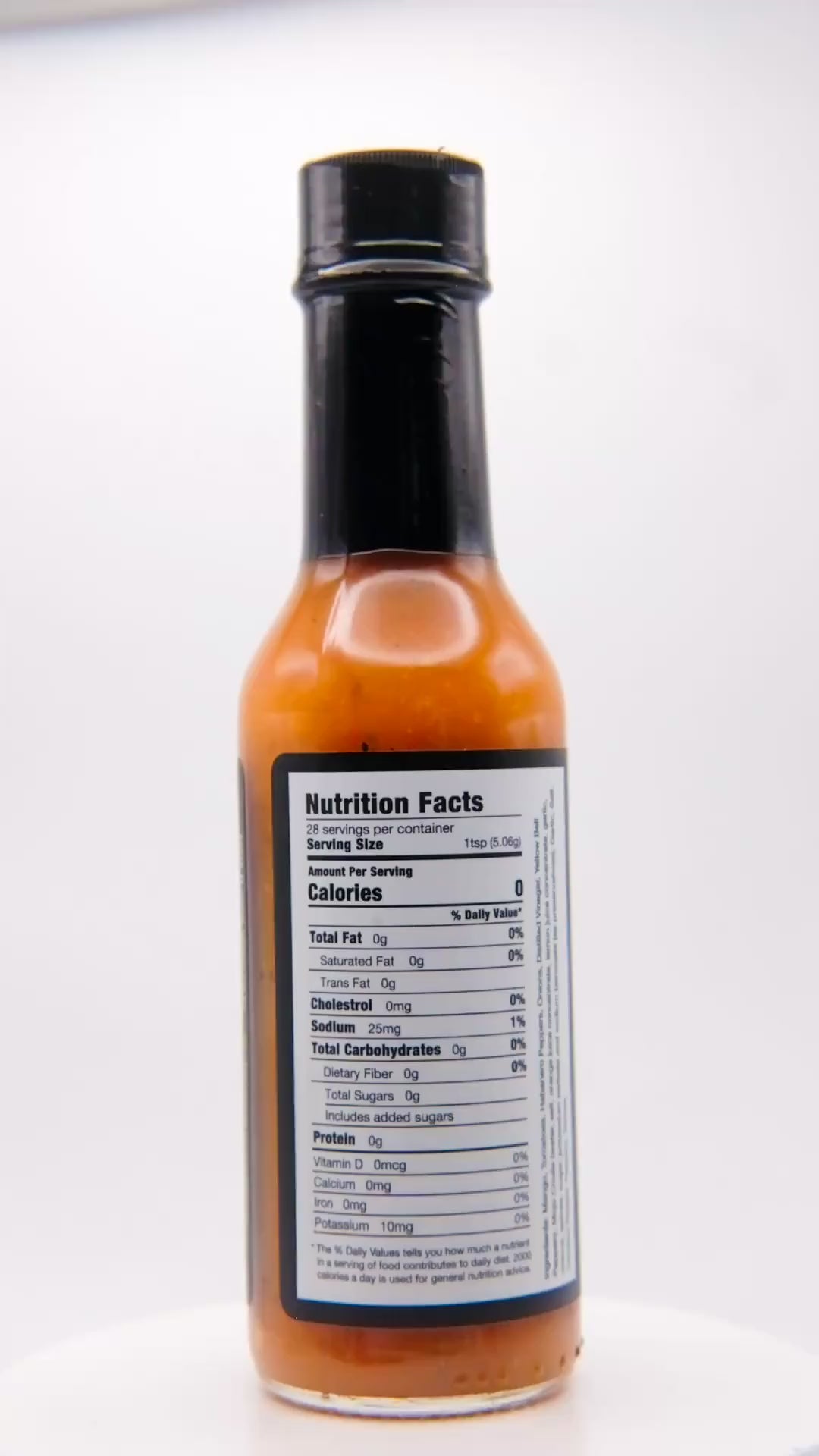 360 degree spin of a bottle of Barbaro Mojo Best Day Ever Cuban hot sauce with the new foil label